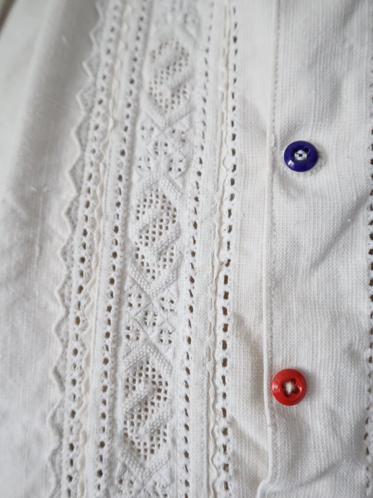 1930s Transylvanian homespun linen folk blouse cutwork embroidery red and blue pressed glass buttons menswear