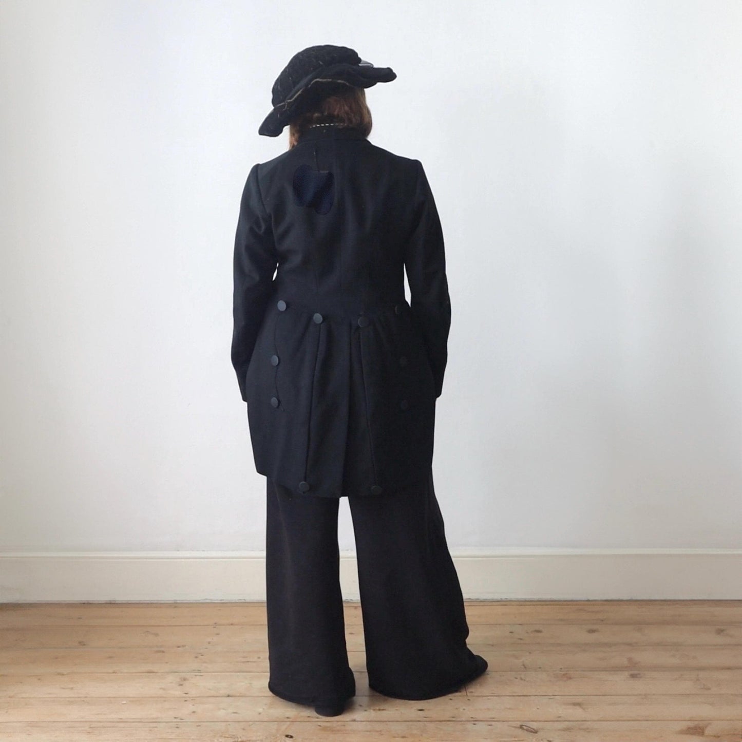Antique Belle Jardinière Paris black wool coat with striped trim and silk buttons early 1900