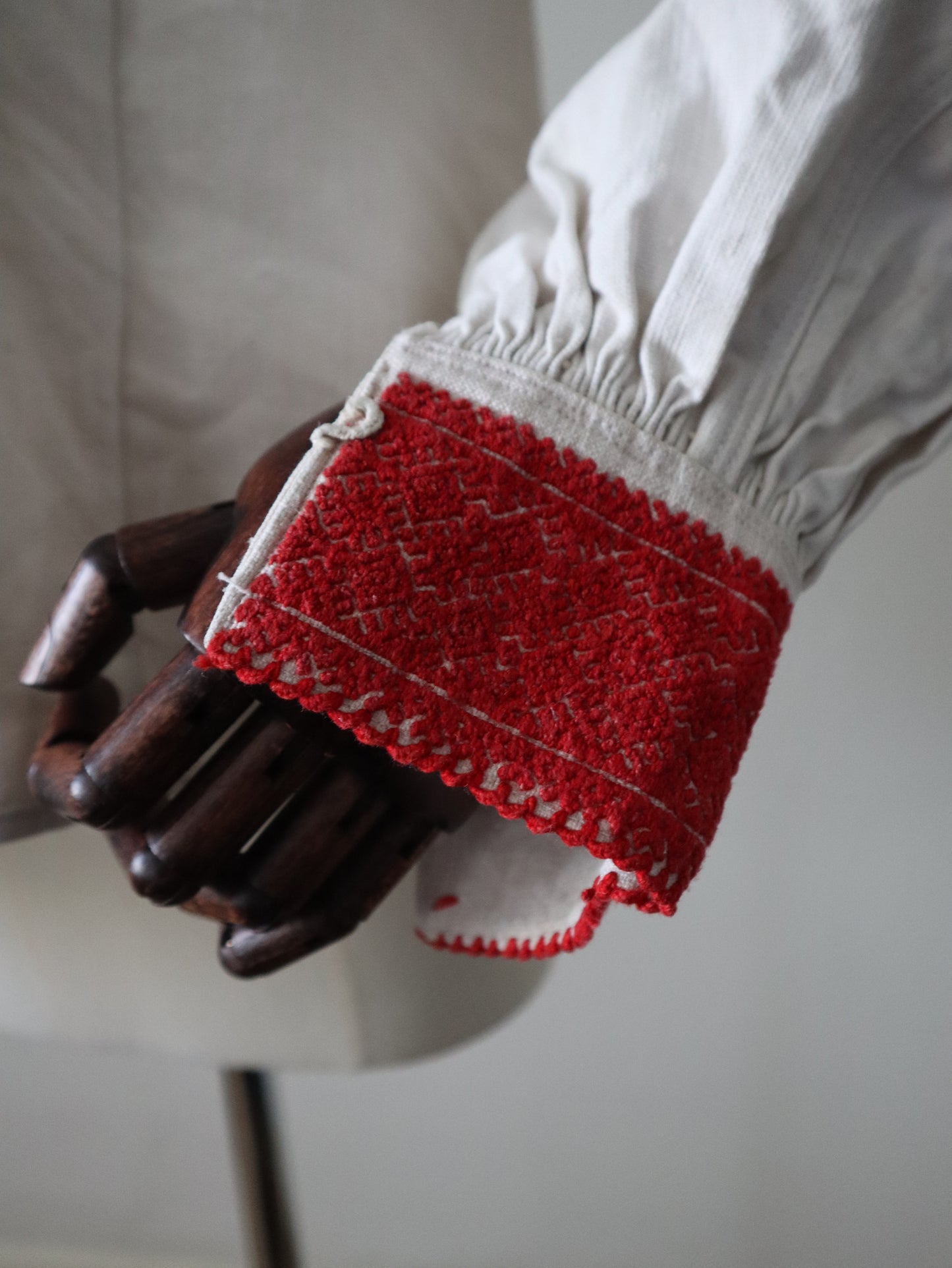 1930s Transylvanian homespun linen folk blouse cutwork embroidery red and blue pressed glass buttons menswear