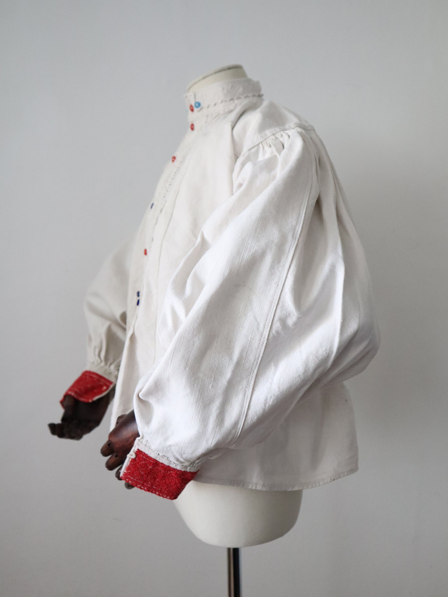 1930s Transylvanian homespun linen folk blouse cutwork embroidery red and blue pressed glass buttons menswear