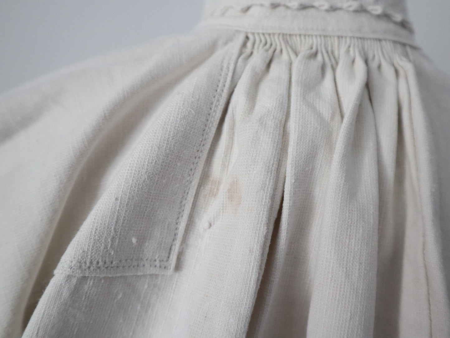 1930s Transylvanian homespun linen folk blouse cutwork embroidery red and blue pressed glass buttons menswear