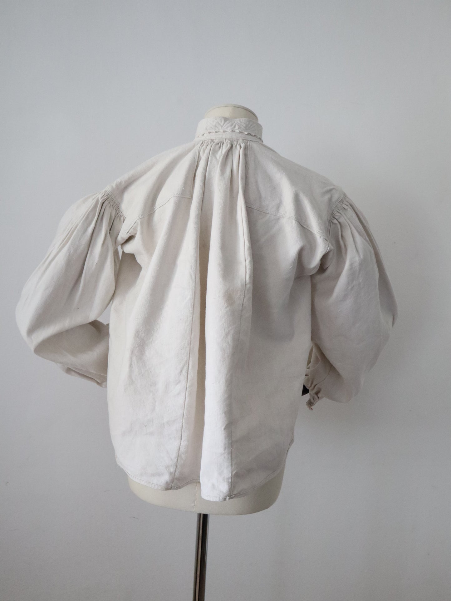 1930s Transylvanian homespun linen folk blouse cutwork embroidery red and blue pressed glass buttons menswear